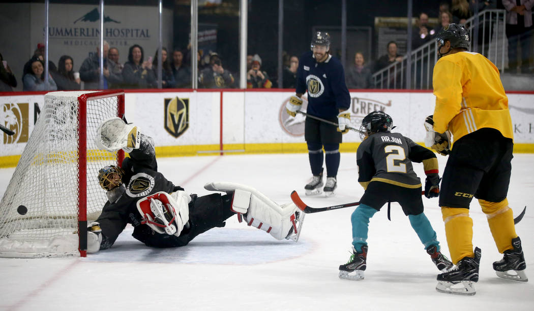 Make-A-Wish kid Arjun Jain, 12, of Somerset, N.J. shoots on Vegas Golden Knights goaltender Mar ...
