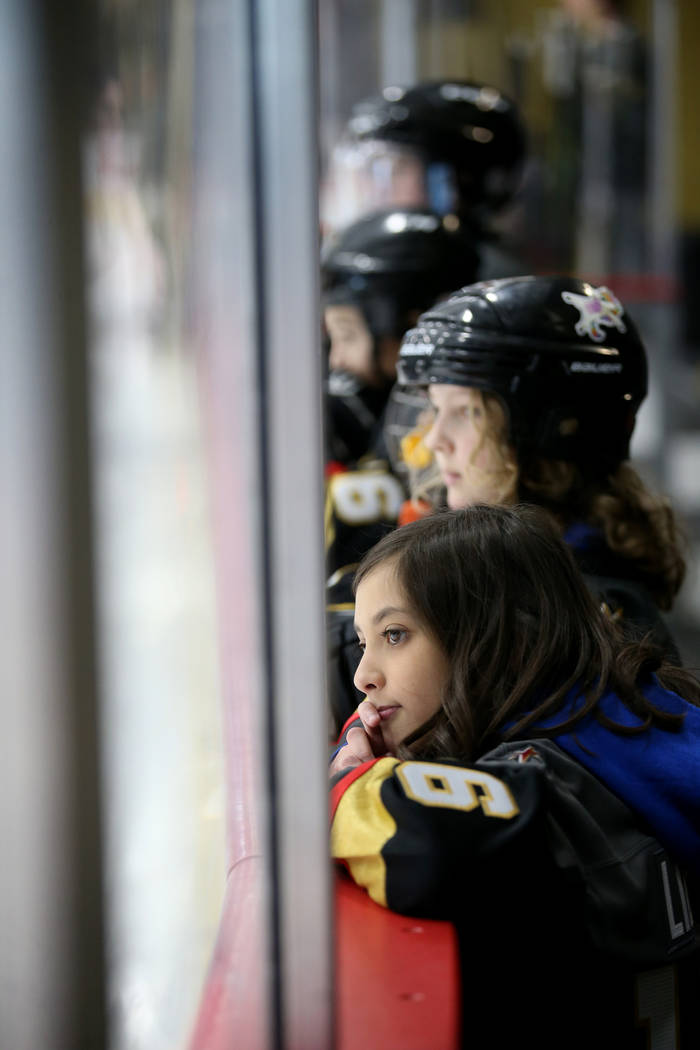 Make-A-Wish kid Sydney Lilore, 10, of Las Vegas, watches Vegas Golden Knights players practice ...