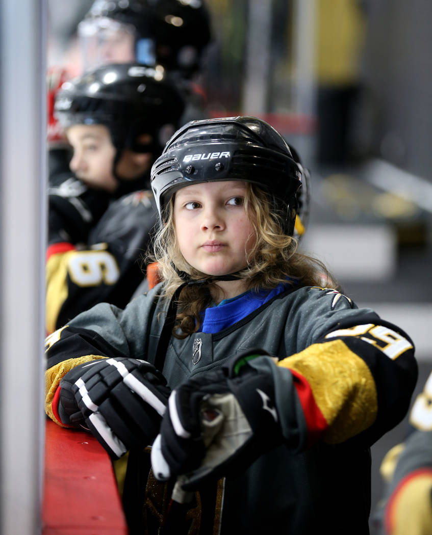 Make-A-Wish kid Roman Runnalls, 10, of Canada watches Vegas Golden Knights players practice at ...