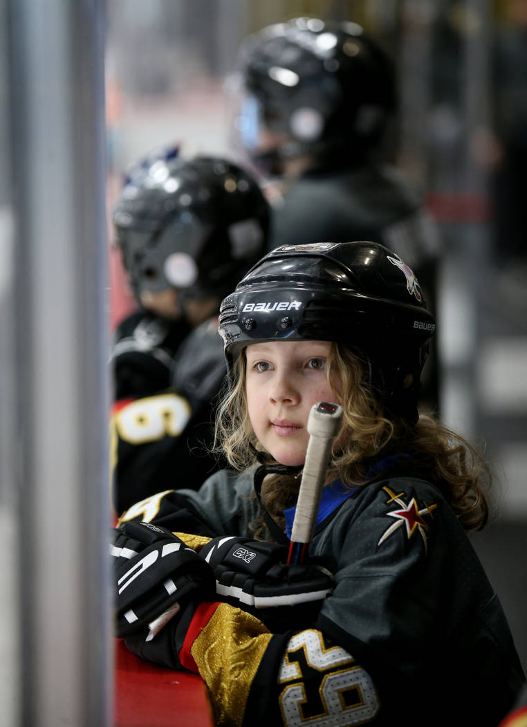 Make-A-Wish kid Roman Runnalls, 10, of Canada watches Vegas Golden Knights players practice at ...