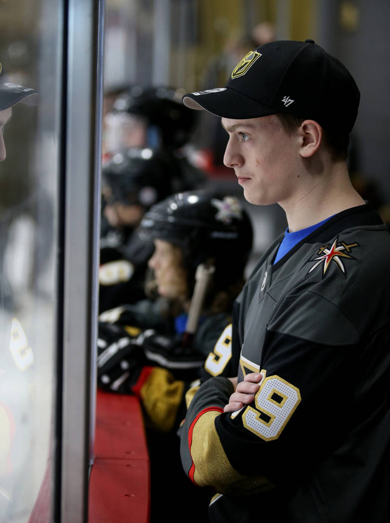 Make-A-Wish kid Ethan LeBaron, 14, of Las Vegas, watches Vegas Golden Knights players practice ...