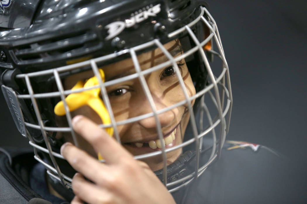 Make-A-Wish kid Arjun Jain, 12, of Somerset, N.J. prepares to skate with Golden Knights players ...