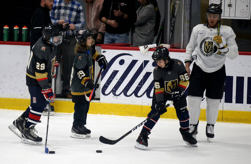 Make-A-Wish kids, from left, Jacob Hoffman, 14, of Saginaw, Mich., Roman Runnalls, 10, of Canad ...