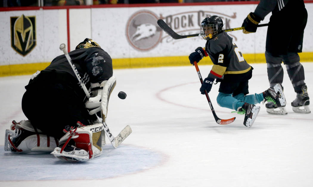 Make-A-Wish kid Arjun Jain, 12, of Somerset, N.J. shoots on Vegas Golden Knights goaltender Mar ...