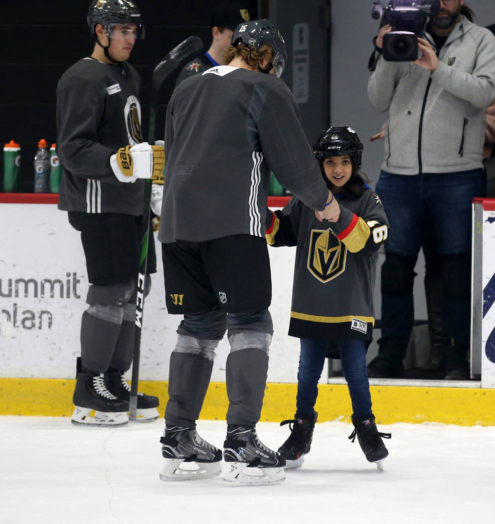 Make-A-Wish kid Sydney Lilore, 10, of Las Vegas, skates with Vegas Golden Knights defenseman Jo ...