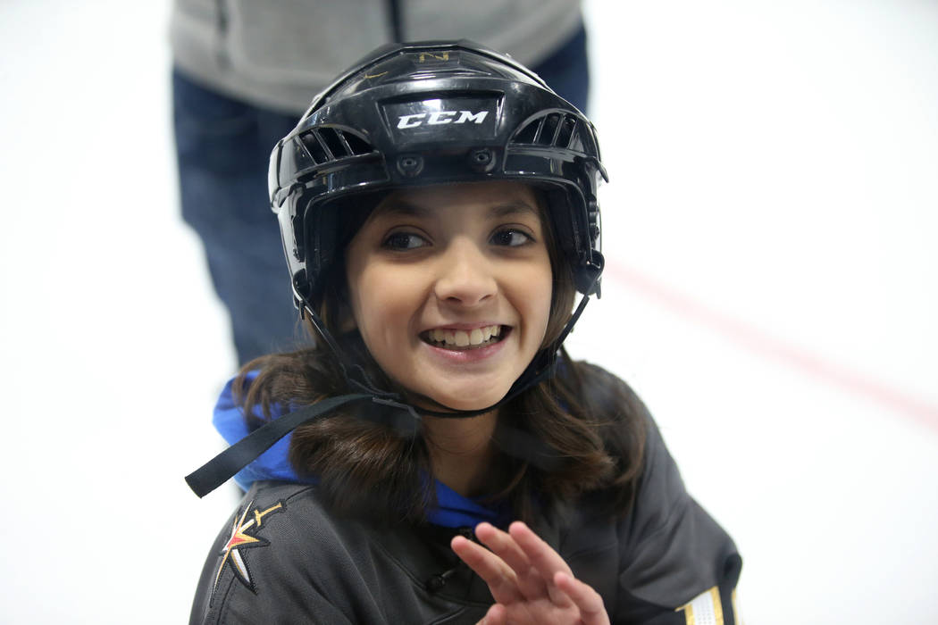 Make-A-Wish kid Sydney Lilore, 10, of Las Vegas, waves to her mother while skating with Vegas G ...