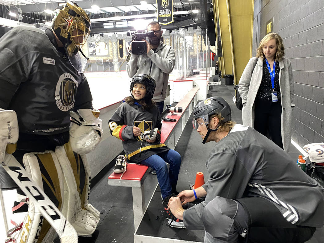Make-A-Wish kid Sydney Lilore, 10, of Las Vegas, is helped by Vegas Golden Knights defenseman J ...