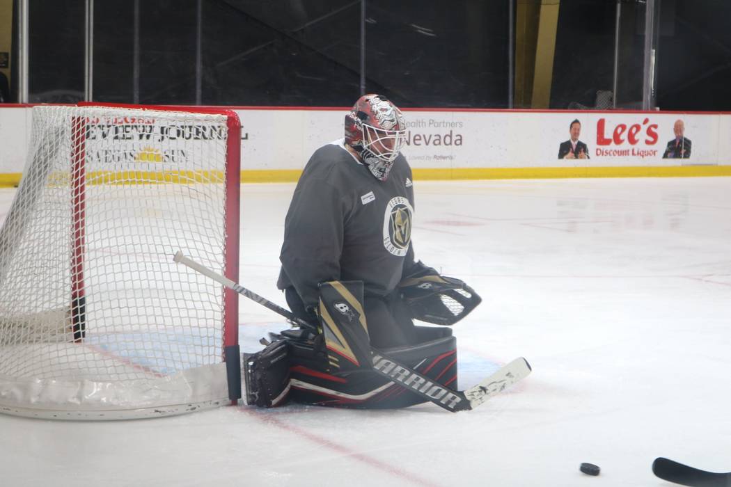 Golden Knights goalie Robin Lehner prepares to block a shot during practice at City National Ar ...
