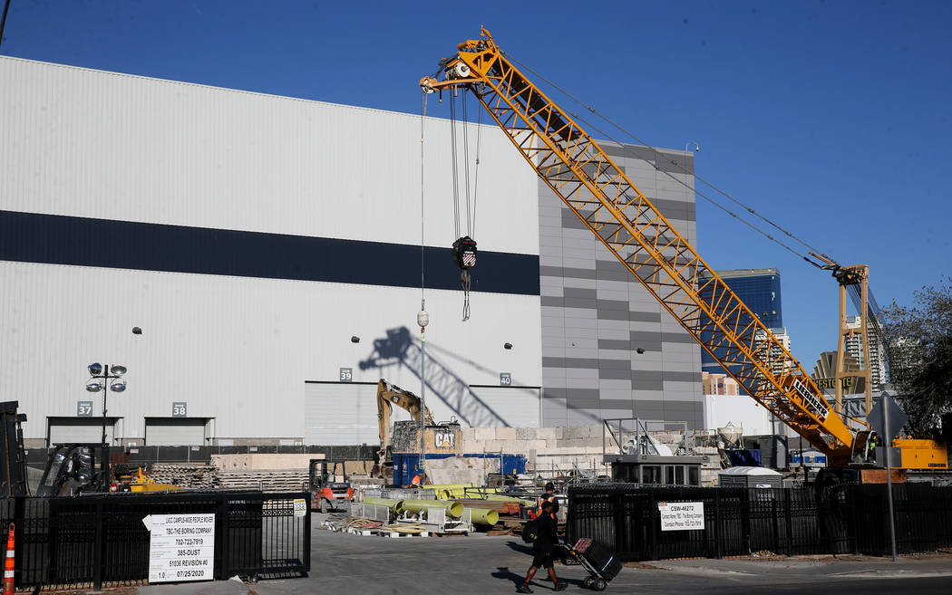 The Boring Co. workers prepare to lower the drill assembly to begin work on the second tunnel i ...