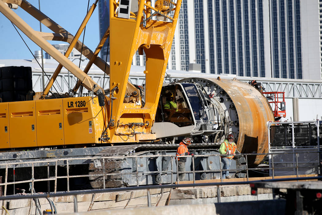 The Boring Co. workers prepare to lower the drill assembly to begin work on the second tunnel i ...