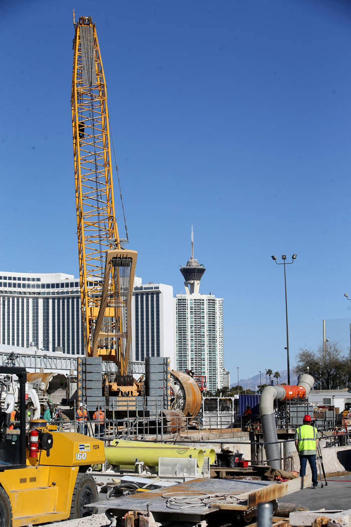 The Boring Co. workers prepare to lower the drill assembly to begin work on the second tunnel i ...