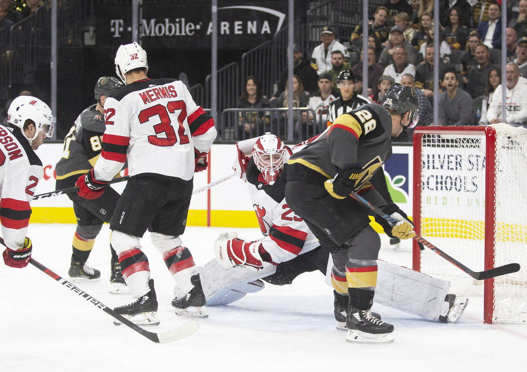 Vegas Golden Knights center Paul Stastny (26) is stoned by New Jersey Devils goaltender Mackenz ...