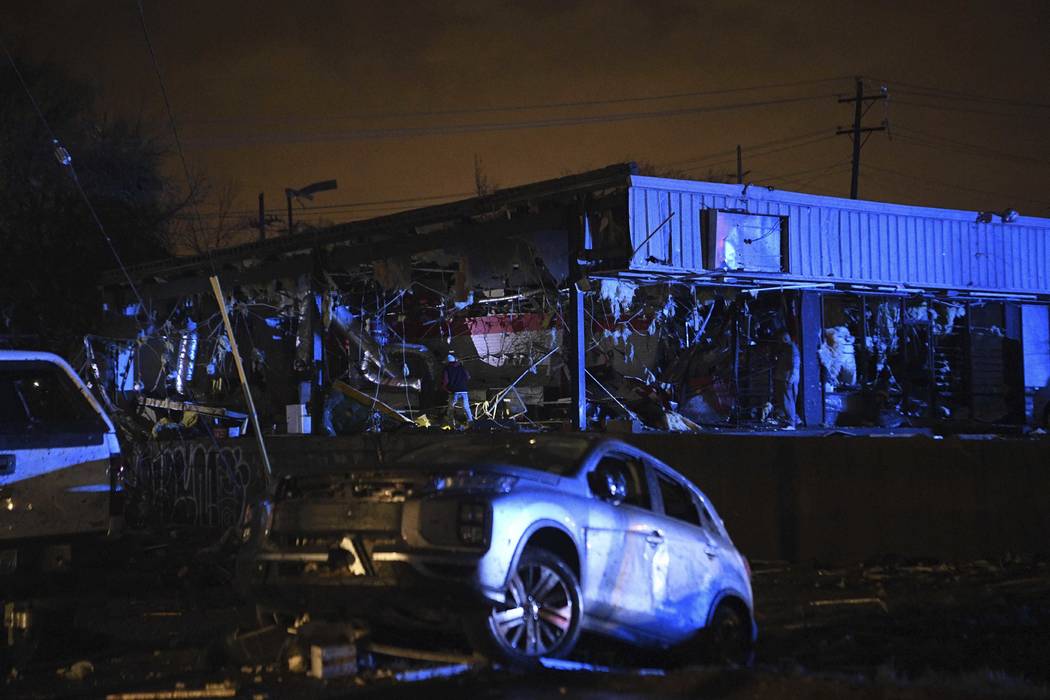 Damaged vehicles and buildings are seen in East Nashville after a tornado hit the city in the e ...