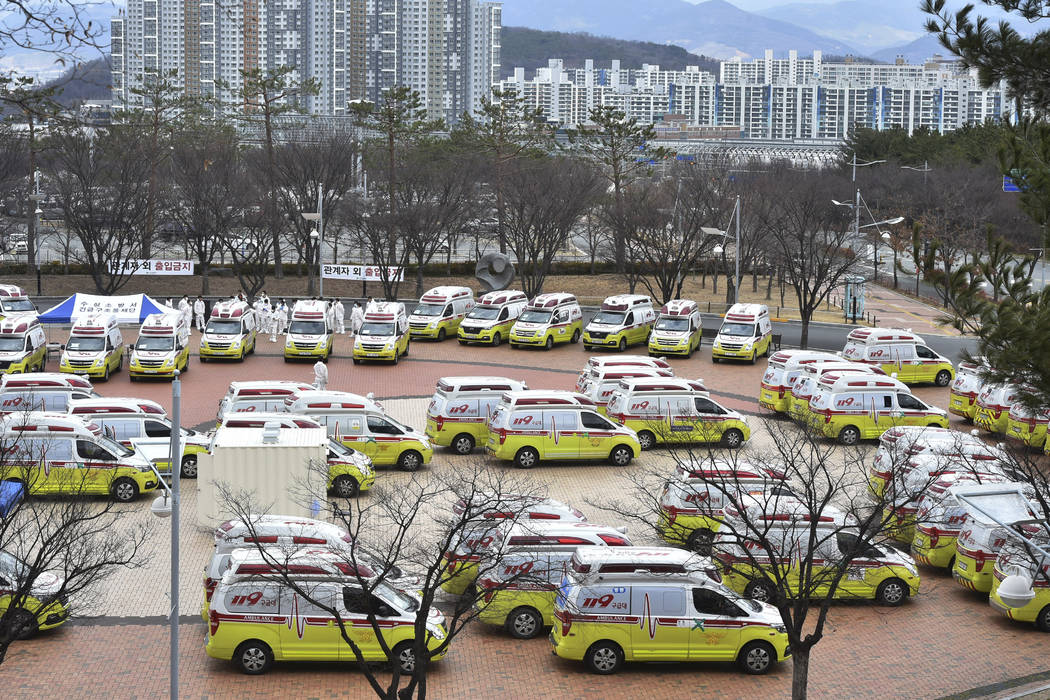 Ambulances are parked to transport patients with mild symptoms of the coronavirus in Daegu, Sou ...