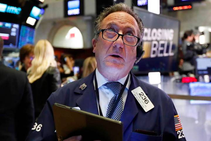 Trader Steven Kaplan watches the numbers at the closing bell on the floor of the New York Stock ...
