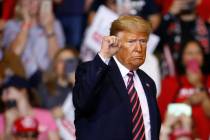 President Donald Trump gestures as he walks offstage after speaking at a campaign rally, Friday ...