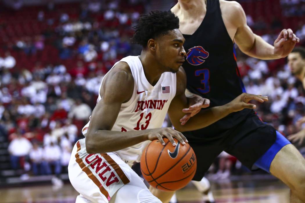 UNLV Rebels' Bryce Hamilton (13) drives to the basket against Boise State Broncos' Justinian Je ...