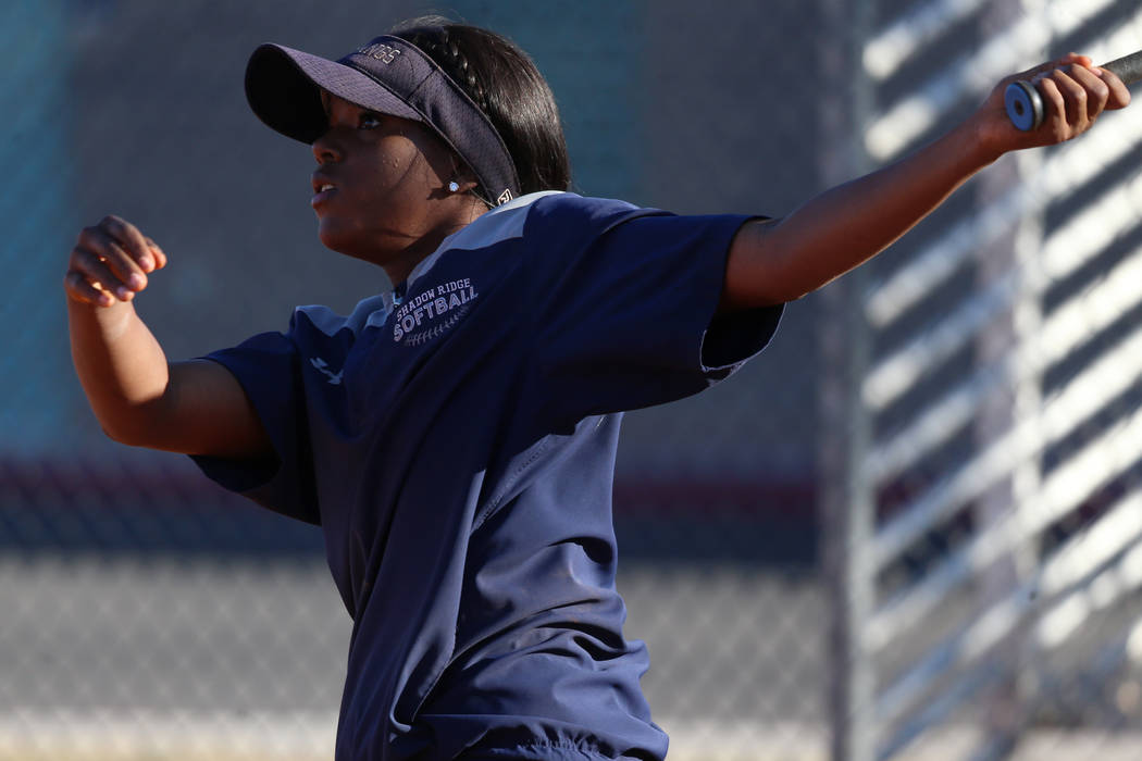 Shadow Ridge's Jasmine Martin, 17, connects with the ball during a softball practice at Shadow ...