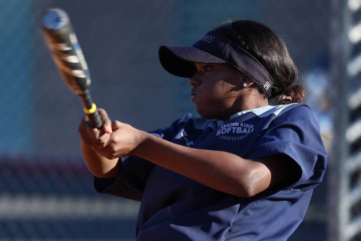 Shadow Ridge's Jasmine Martin, 17, connects with the ball during a softball practice at Shadow ...