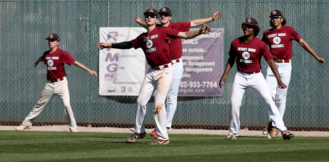 Desert Oasis baseball players warm up during a light practice at the school in Las Vegas Wednes ...