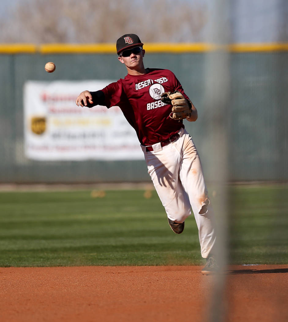 Desert Oasis shortstop Colby Smith tosses the ball in during batting practice at the school in ...