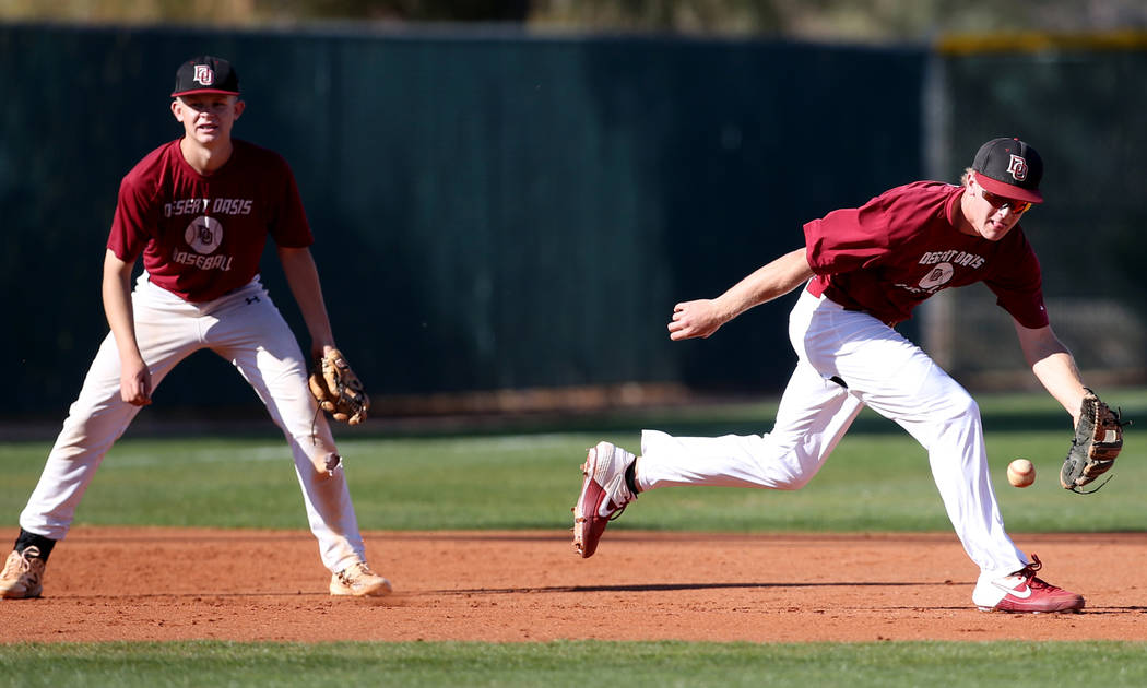 Desert Oasis third baseman Colton Zobrist fields the ball during batting practice at the school ...