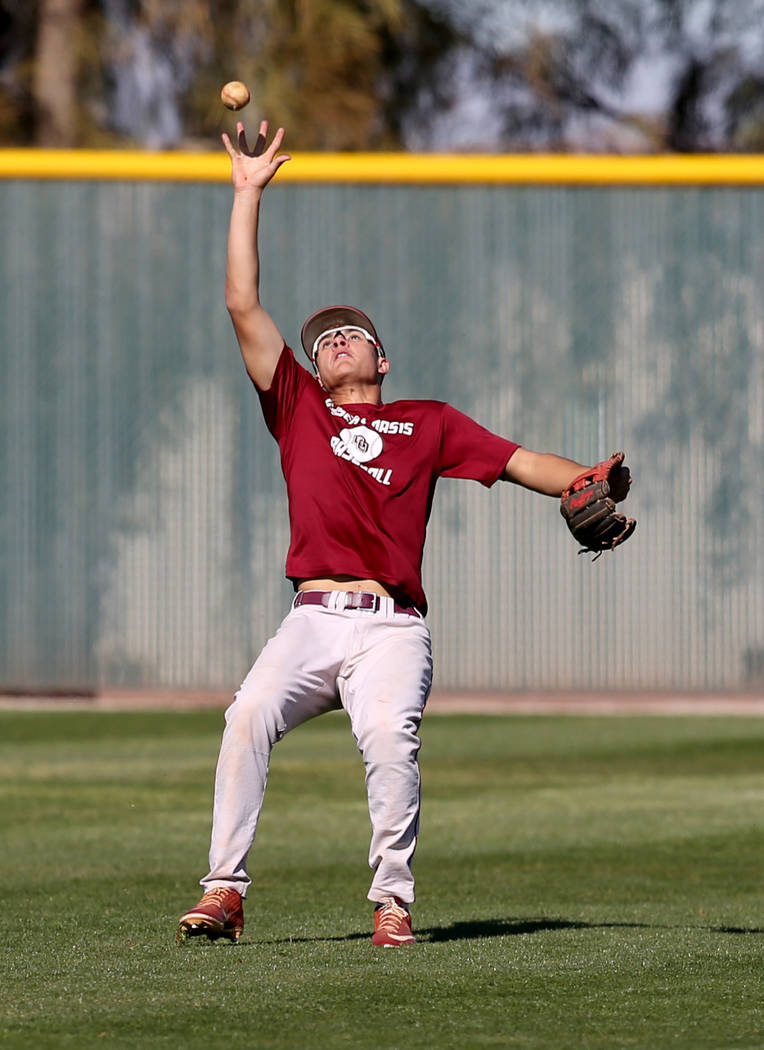 Desert Oasis Jacob Baca catches the ball during batting practice at the school in Las Vegas Wed ...
