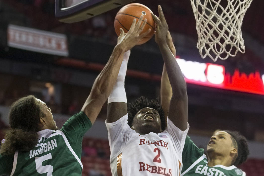 UNLV Rebels forward Donnie Tillman (2) drives past Eastern Michigan Eagles guard Noah Morgan (5 ...