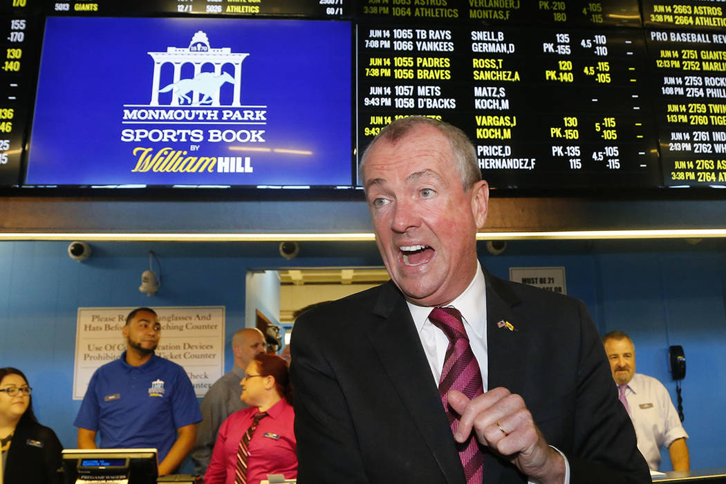 New Jersey Governor Phil Murphy, arrivers to make the first wager with Monmouth Park Sports Boo ...