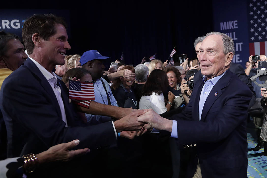 Democratic presidential candidate former New York City Mayor Mike Bloomberg shakes hands during ...
