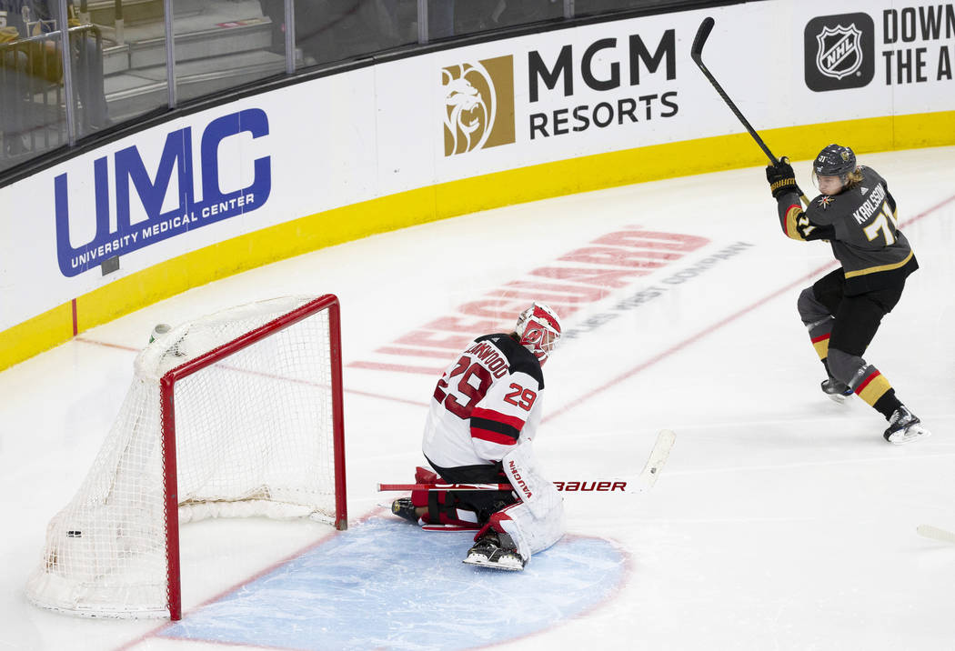 Vegas Golden Knights center William Karlsson (71) scores against New Jersey Devils goaltender M ...