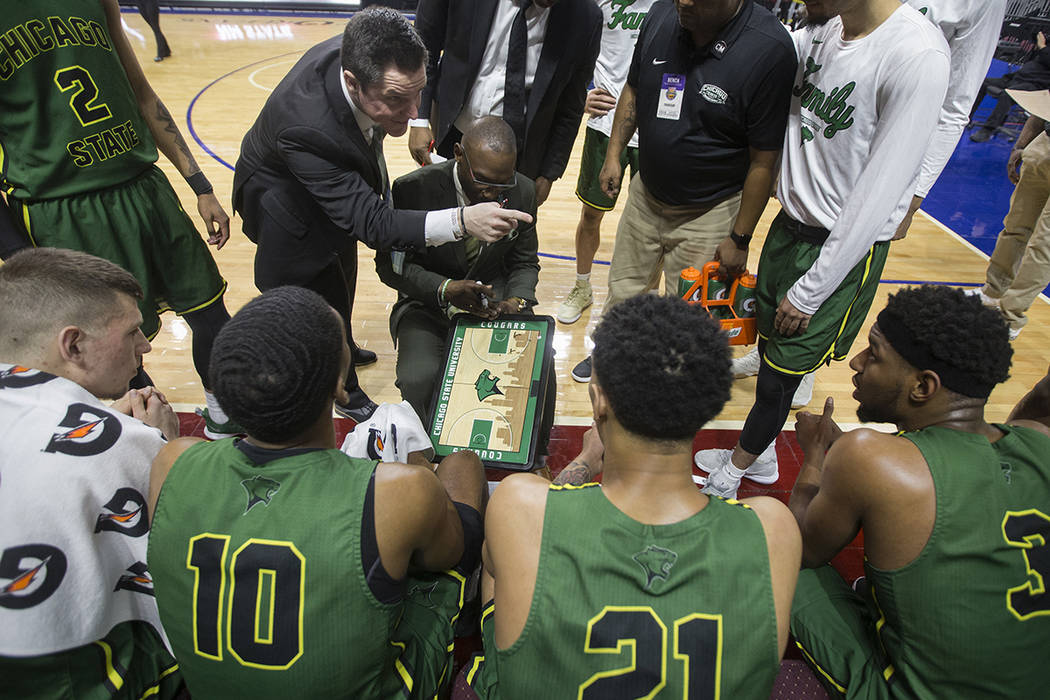 Chicago State gets coached up during a timeout in the second half during the Cougars opening ro ...