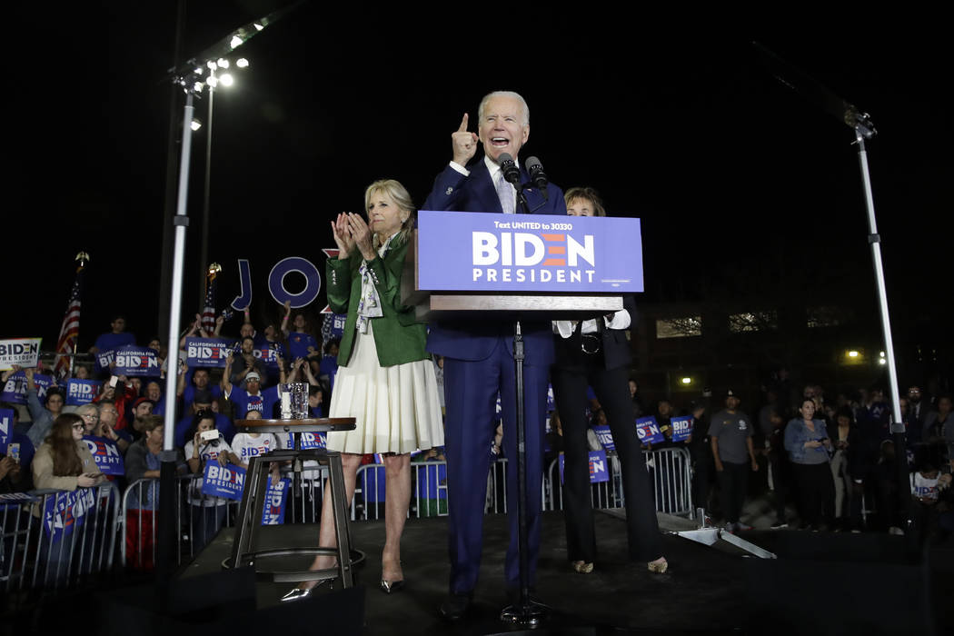 Democratic presidential candidate former Vice President Joe Biden speaks, next to his wife Jill ...