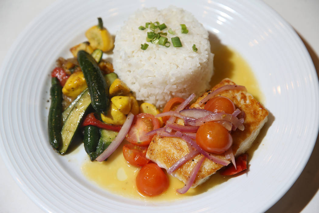 The pacific halibut served with tomato and red onion salad, steamed rice and beurre blanc sauce ...