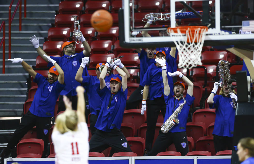 Boise State Broncos band members try to distract Fresno State Bulldogs' Maddi Utti (11) during ...