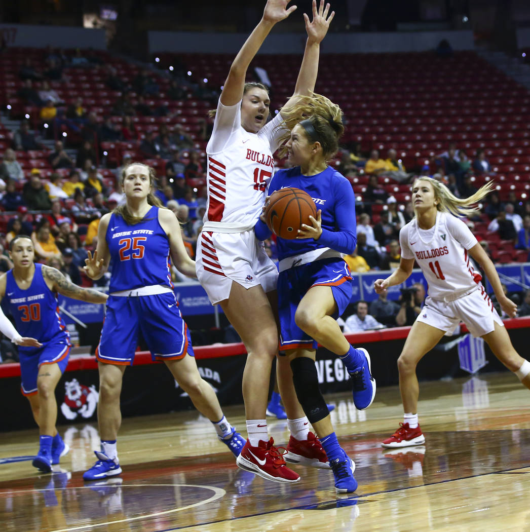 Boise State Broncos' Braydey Hodgins (14) gets fouled while going to the basket against Fresno ...