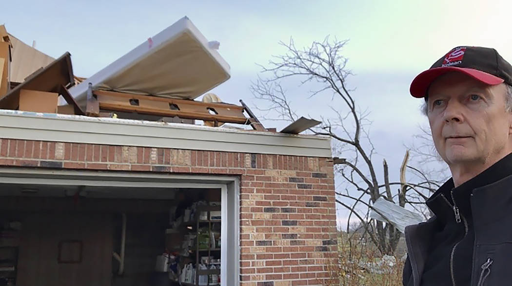 In this Tuesday, March 3, 2020 photo, Billy Dyer of Baxter, Tenn., stands beside his home damag ...