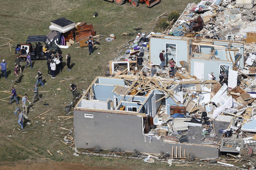 People work to salvage items Tuesday, March 3, 2020, near Cookeville, Tenn. Tornadoes ripped ac ...