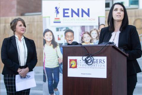 Amanda Morgan, right, executive director of Educate Nevada Now, speaks during a press conferenc ...
