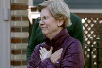 Sen. Elizabeth Warren, D-Mass., acknowledges supporters as she arrives to speak to the media ou ...