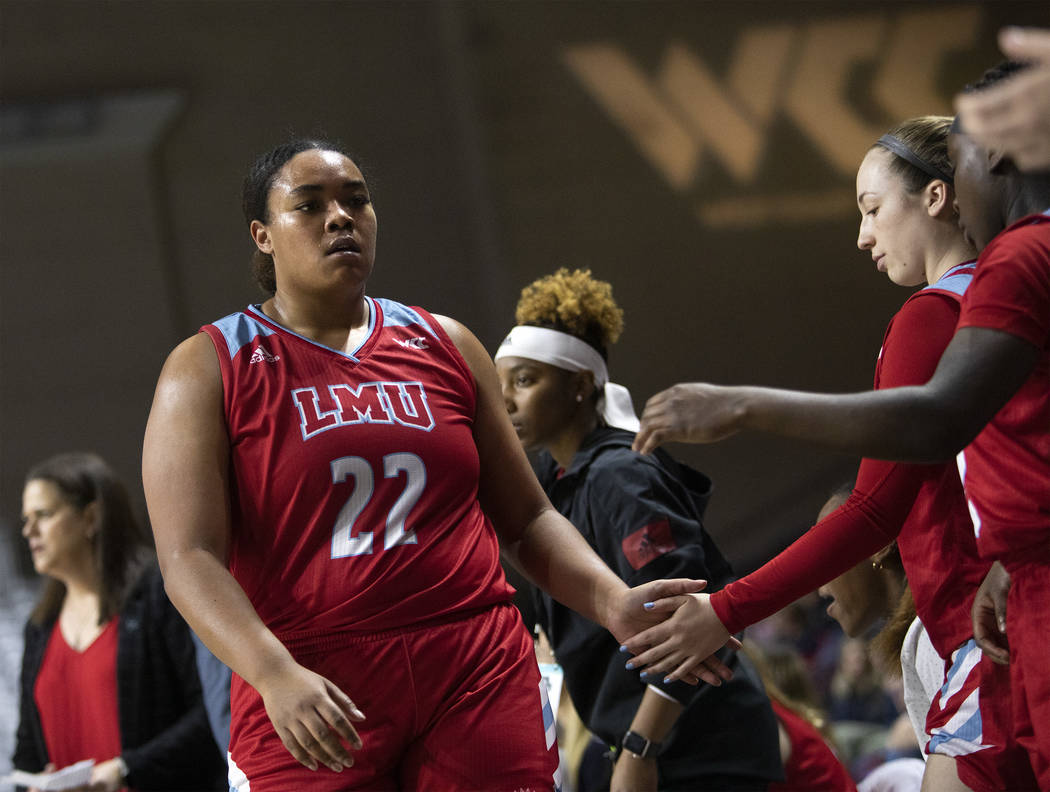 Loyola Marymount's center Raychel Stanley (22) returns to the bench during the first round of t ...