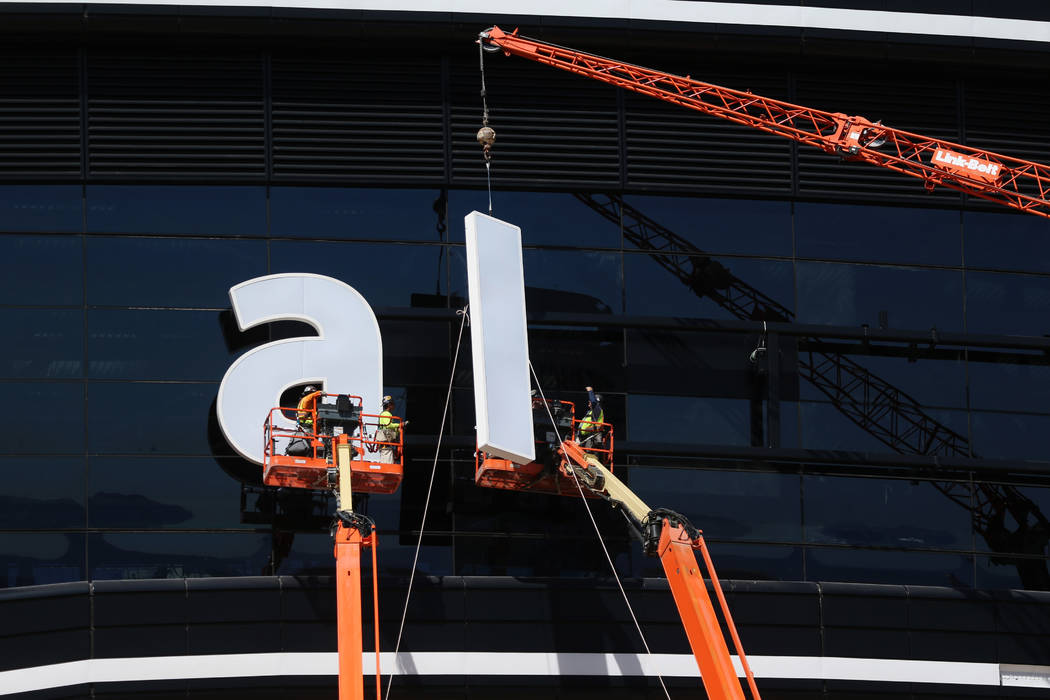 The sign gets installed at the Raiders Allegiant Stadium in Las Vegas, Thursday, March 5, 2020. ...