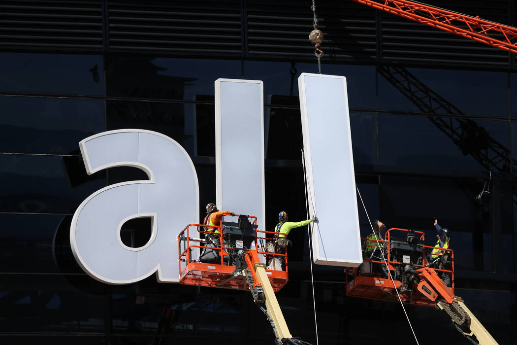 The sign gets installed at the Raiders Allegiant Stadium in Las Vegas, Thursday, March 5, 2020. ...