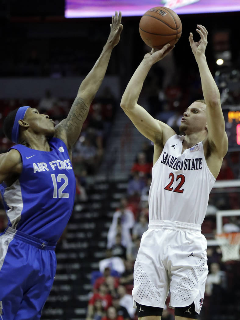 San Diego State's Malachi Flynn (22) shoots as Air Force's Lavelle Scottie defends during the s ...