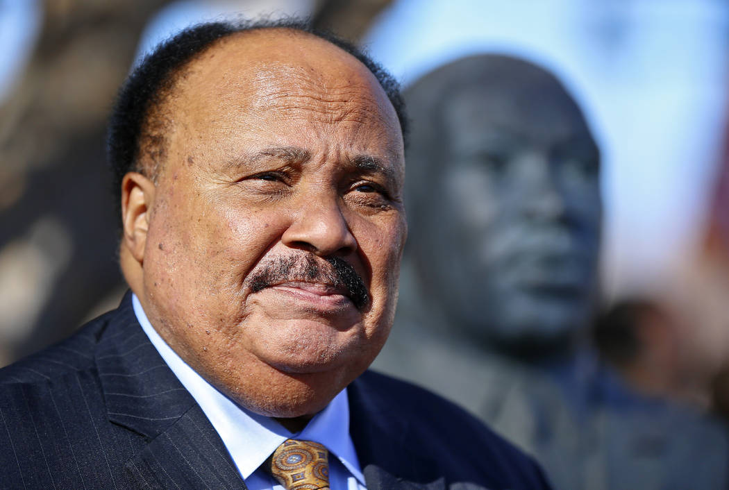 FILE - In this Jan. 25, 2018, file photo, Martin Luther King III stands next to a bust of his f ...
