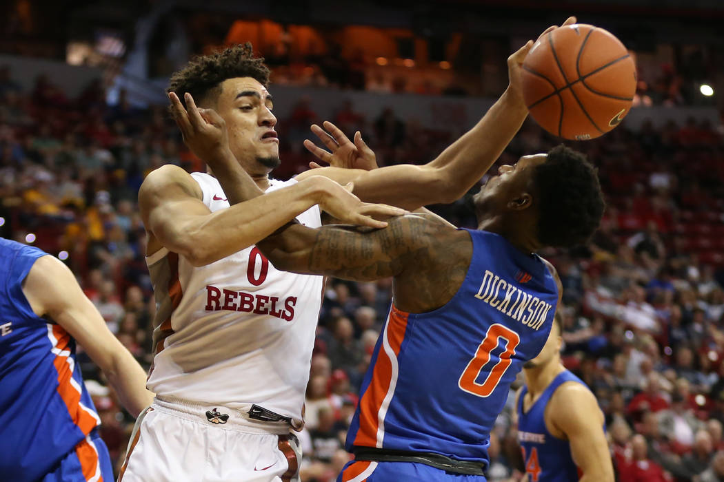 UNLV Rebels guard Jay Green (0) battles for a loose ball against Boise State Broncos guard Marc ...