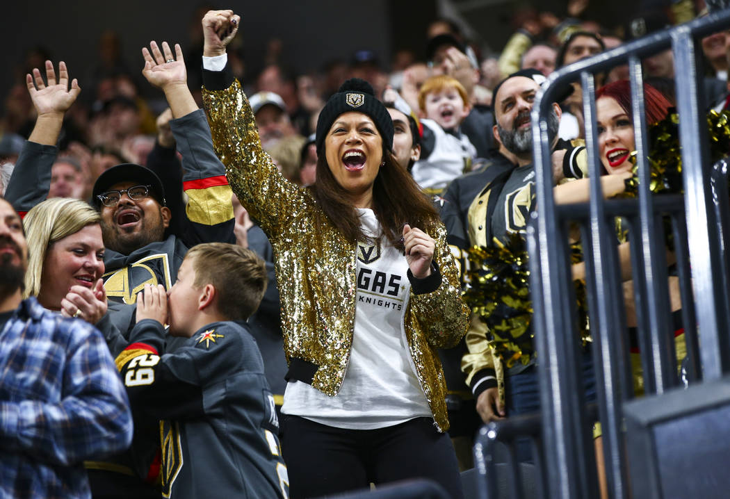 Golden Knights fans celebrate a goal by Tomas Nosek, not pictured, during the first period of a ...