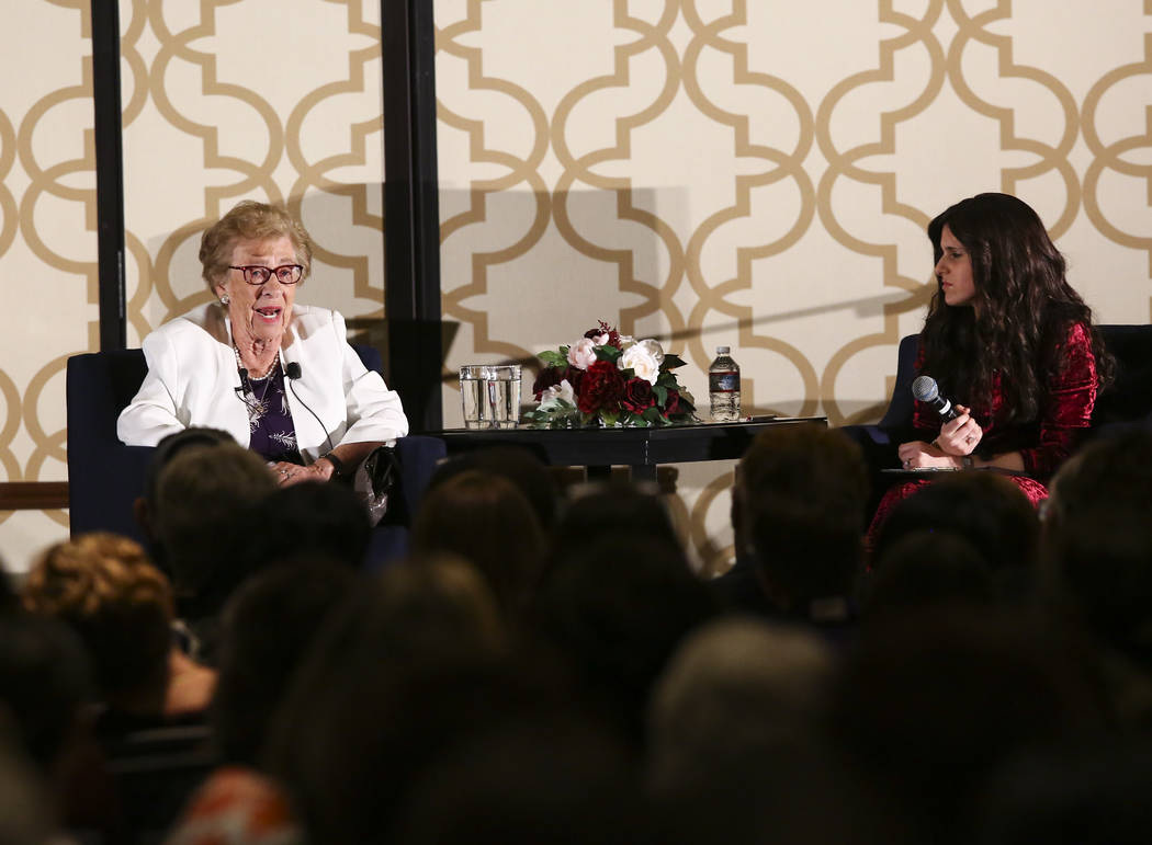 Eva Schloss, stepsister of Anne Frank, left, speaks with Binie Rivkin, co-director of Chabad of ...