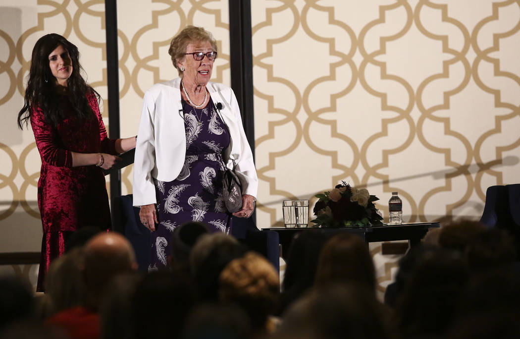 Eva Schloss, stepsister of Anne Frank, right, is introduced with the help of Binie Rivkin, co-d ...