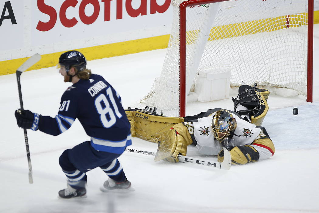 Winnipeg Jets' Kyle Connor (81) scores on Vegas Golden Knights goaltender Marc-Andre Fleury (29 ...